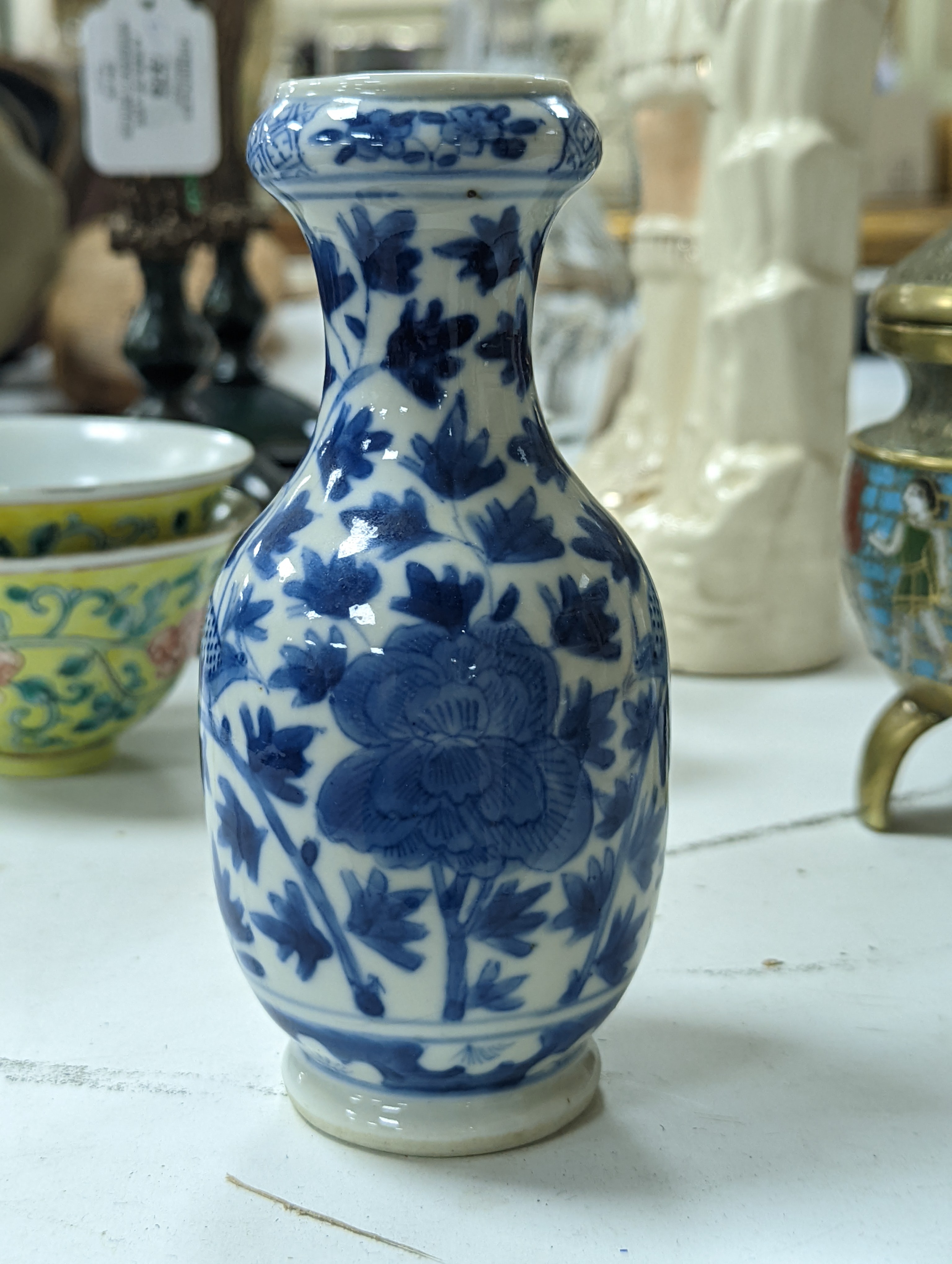 A group of Chinese porcelain, 19th /20th century, to include a pair of yellow ground bowls, 10.8 cm diameter, a blue and white vase, Xuande mark, a similar bowl and vase, and a champleve enamel bronze koro and cover